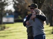 Heritage High School student Yvette Nesukh, 17, embraces her dad Vitaly Nesukh after the modified lockdown was lifted at Heritage High School on Friday afternoon, Nov. 16, 2018. The school was placed on a modified lockdown after someone shot a firearm into the ground at the softball fields near campus. "I can't tell you how I felt," Vitaly said.