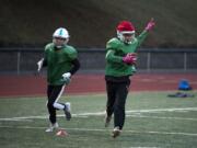 Mountain View’s Michael Bolds, right, runs through defensive drills with his team during practice at McKenzie Stadium. Bolds has a school-record eight interceptions this season.