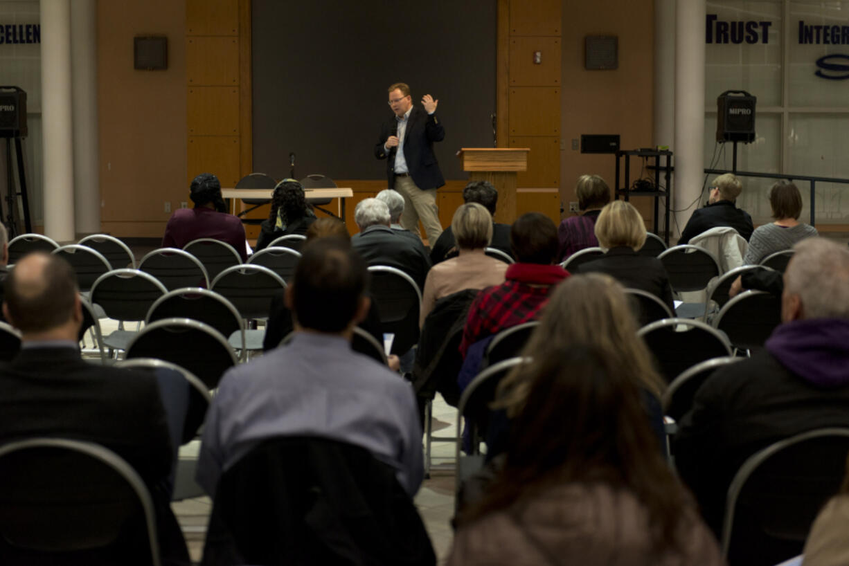 State Superintendent of Public Instruction Chris Reykdal hosts a community forum Wednesday night at Skyview High School in Vancouver to discuss his ideas for the future of education in the state and the recent teacher strikes. Right: The Columbian’s education reporter, Katie Gillespie, moderates the forum Wednesday night.