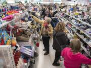 Shoppers pack an aisle of the new Vancouver Goodwill at 14201 N.E. Fourth Plain Blvd. during the grand opening Thursday.