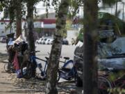 Bikes and belongings sit next to a van near Share House in Vancouver on Monday, Aug. 28, 2017.