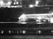 The Boeing 727 hijacked by D.B. Cooper sits on a runway at Seattle-Tacoma International Airport before taking off and heading south. The man whose real name probably wasn’t Cooper parachuted out the back of the plane in a dark business suit with $200,000 in ransom money. The FBI believes he probably didn’t survive the jump, but many others believe there’s much more to the mystery.