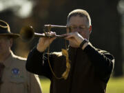 Bugle player Greg Garrett of Vancouver plays taps during a commemoration of the armistice ending World War I at the Fort Vancouver parade grounds Sunday.