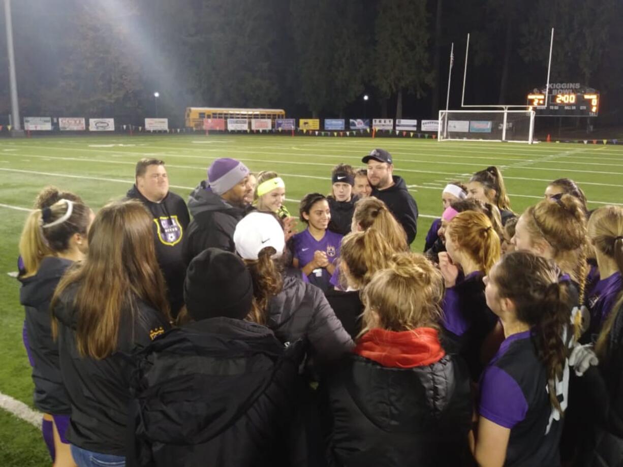 Coach Filly Afenegus talks to the Columbia River girls soccer team after their 2-0 win over Fife (Tim Martinez/The Columbian)
