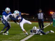 Mountain View running back Jack Mertens breaks tackles to stay in bounds against Squalicum at McKenzie Stadium on Saturday night, November 11, 2018. Mountain View crushed Squalicum 42-0 in the first round of the 3A state football playoffs.