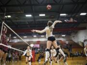 Mountain View’s Grace Garmire, one of seven seniors on the Thunder volleyball team, jumps to spike the ball against Prairie during a recent match.