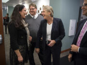 Alishia Topper, left, discusses election results with other candidates Nov. 7 at the Public Service Center.