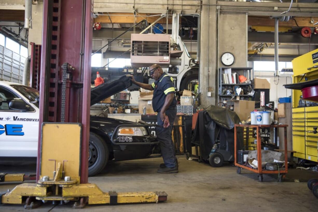 Technician Lanell Jackson works on a police vehicle in the Equipment Services building at the Vancouver Operations Center. Operations Manager Tim Buck says the Equipment Services building is outdated and cramped. Currently, the firetrucks being serviced are housed at Vancouver Fire Department Station 5 because they are too large for this location.