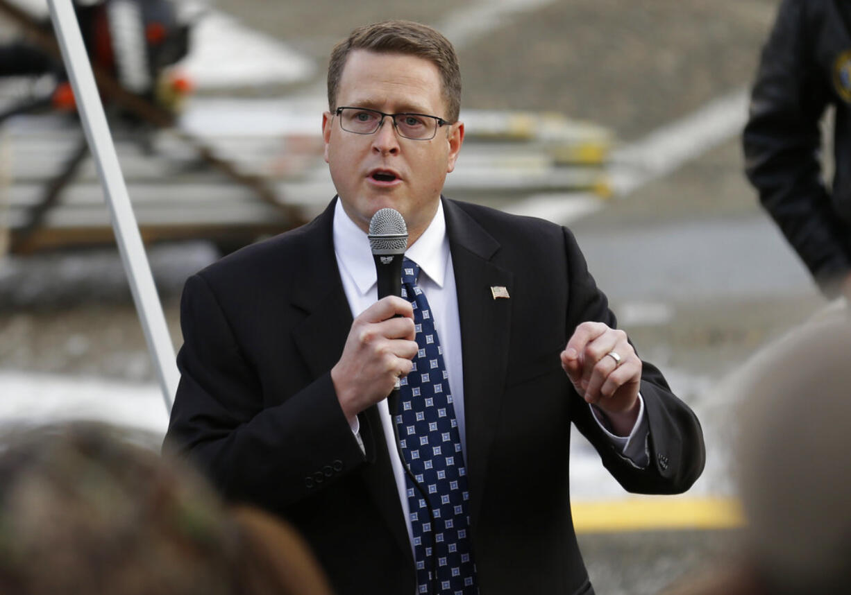 FILE - In this Jan. 13, 2017 file photo Rep. Matt Shea, R-Spokane, speaks at a gun-rights rally, at the Capitol in Olympia, Wash.Shea, is facing intense criticism for distributing a document describing how a "Holy Army" should kill people who flout "biblical law," with some campaign donors asking for their contributions back. (AP Photo/Ted S.