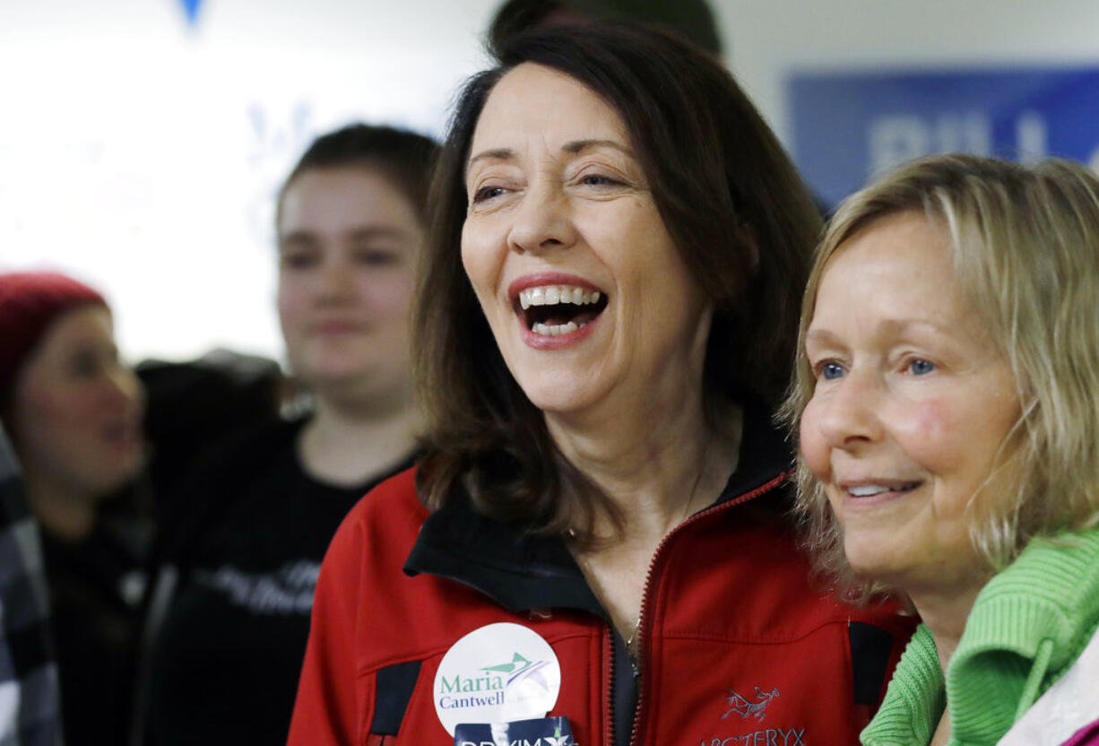 Democratic Sen. Maria Cantwell, left, smiles as she greets supporters during a campaign event, Monday, Nov. 5, 2018, in Issaquah, Wash. Former state GOP chairwoman Susan Hutchison is challenging Cantwell, a three-term incumbent. Public polling has shown Cantwell with a comfortable lead as she seeks her fourth term.