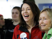 Democratic Sen. Maria Cantwell, left, smiles as she greets supporters during a campaign event, Monday, Nov. 5, 2018, in Issaquah, Wash. Former state GOP chairwoman Susan Hutchison is challenging Cantwell, a three-term incumbent. Public polling has shown Cantwell with a comfortable lead as she seeks her fourth term.