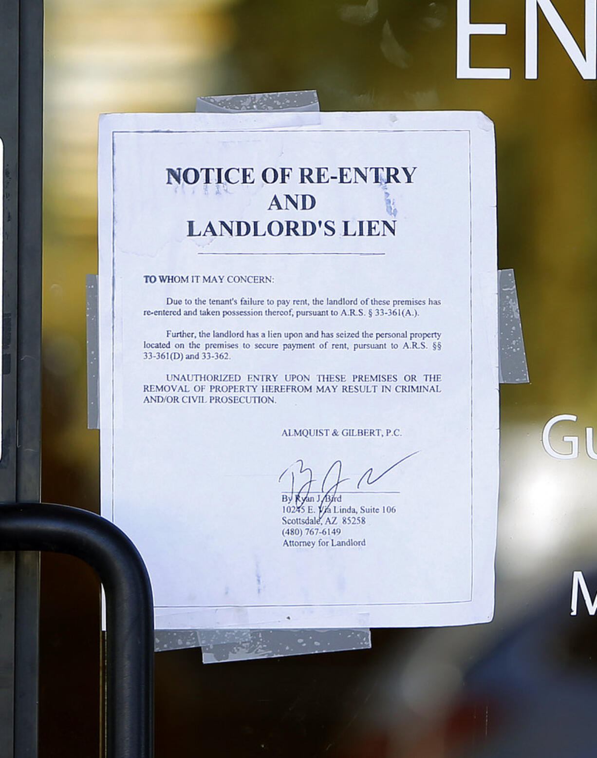 A notice sign is seen at a polling station, Tuesday, Nov. 6, 2018 in Chandler, Ariz. A new polling station opened four hours late after the original location did not open due to the buildings' foreclosure overnight.