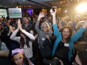 Supporters cheer Congressional candidate Kim Schrier as she addresses the crowd at an election night party for Democrats Tuesday, Nov. 6, 2018, in Bellevue, Wash.