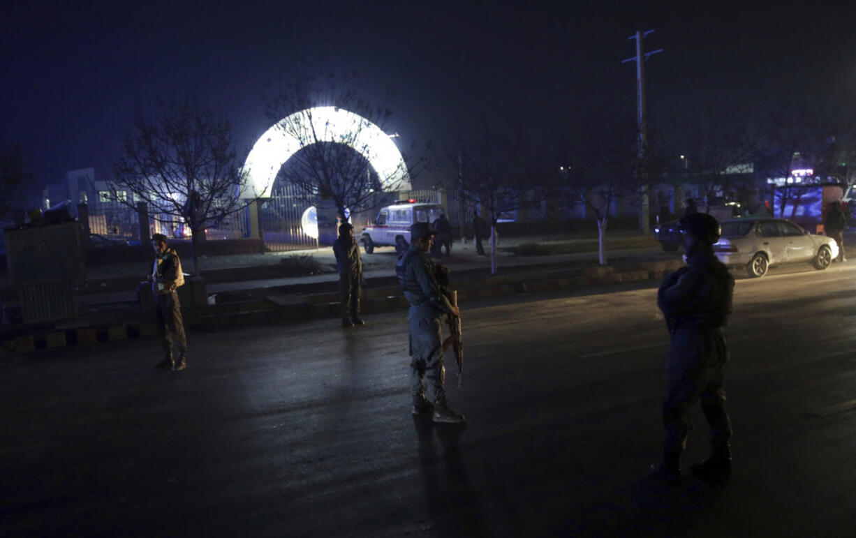 Security forces block the main road at the site of a suicide attack in Kabul, Afghanistan, Nov. 20, 2018. Afghan officials said the suicide bomber targeted a gathering of Muslim religious scholars in Kabul.