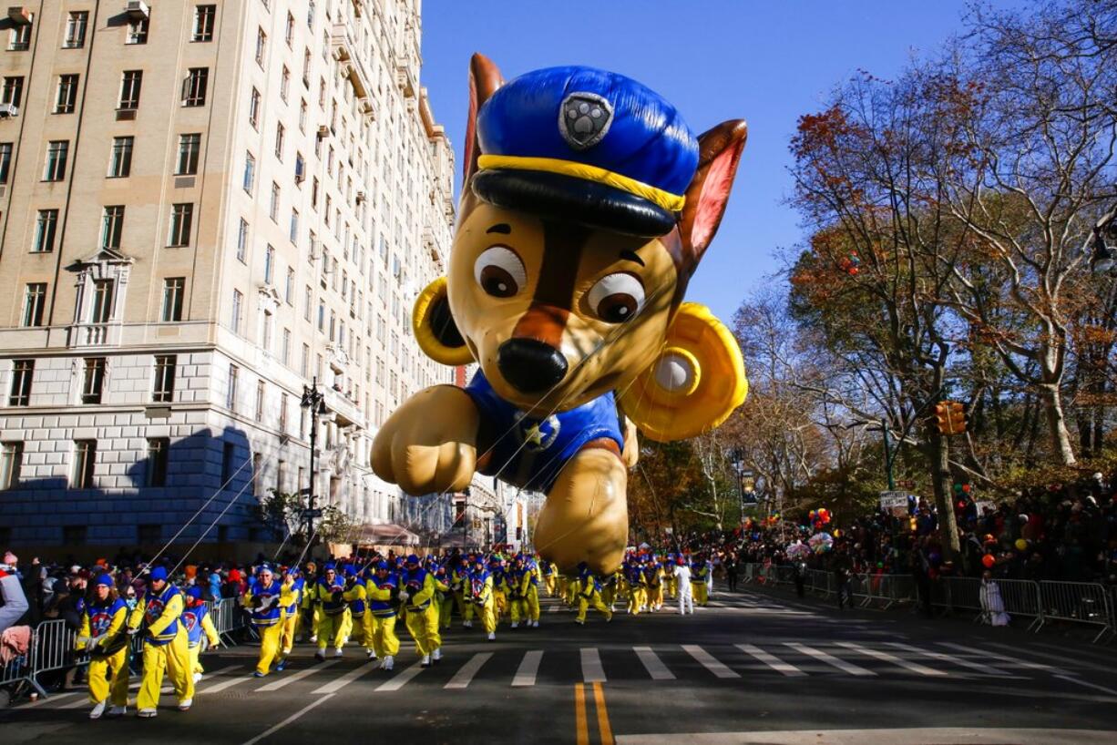 A "PAW Patrol" balloon floats over Central Park West during the 92nd annual Macy's Thanksgiving Day Parade in New York, Thursday, Nov. 22, 2018.