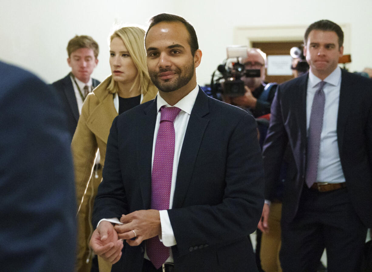 FILE - In this Oct. 25, 2018, file photo, George Papadopoulos, the former Trump campaign adviser who triggered the Russia investigation, arrives for his first appearance before congressional investigators, on Capitol Hill in Washington. A judge has rejected an effort by former Trump campaign foreign policy adviser Papadopoulos to delay his two-week prison term and says Papadopoulos must surrender Monday, Nov. 26, as scheduled.