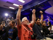 People at NASA's Jet Propulsion Laboratory in Pasadena, Calif., celebrate as the InSight lander touches down on Mars on Monday, Nov. 26, 2018.