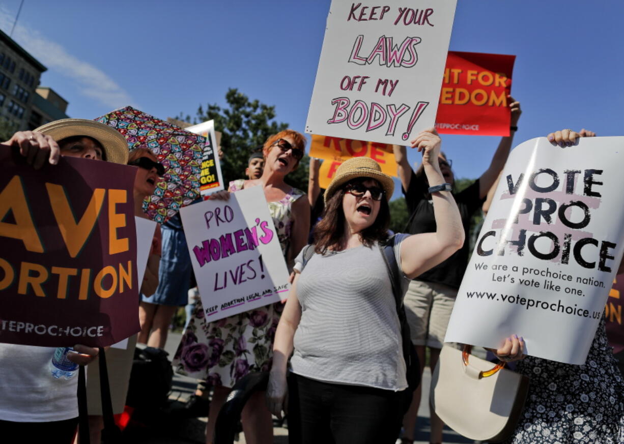 FILE - In this July 10, 2018 file photo, women demonstrate during a pro-choice rally in New York. On Wednesday, Nov. 28, 2018, representatives of several national anti-abortion groups met with administration staffers at the White House to discuss how President Donald Trump _ who has supported their agenda _ could continue to be helpful in the changed political circumstances.