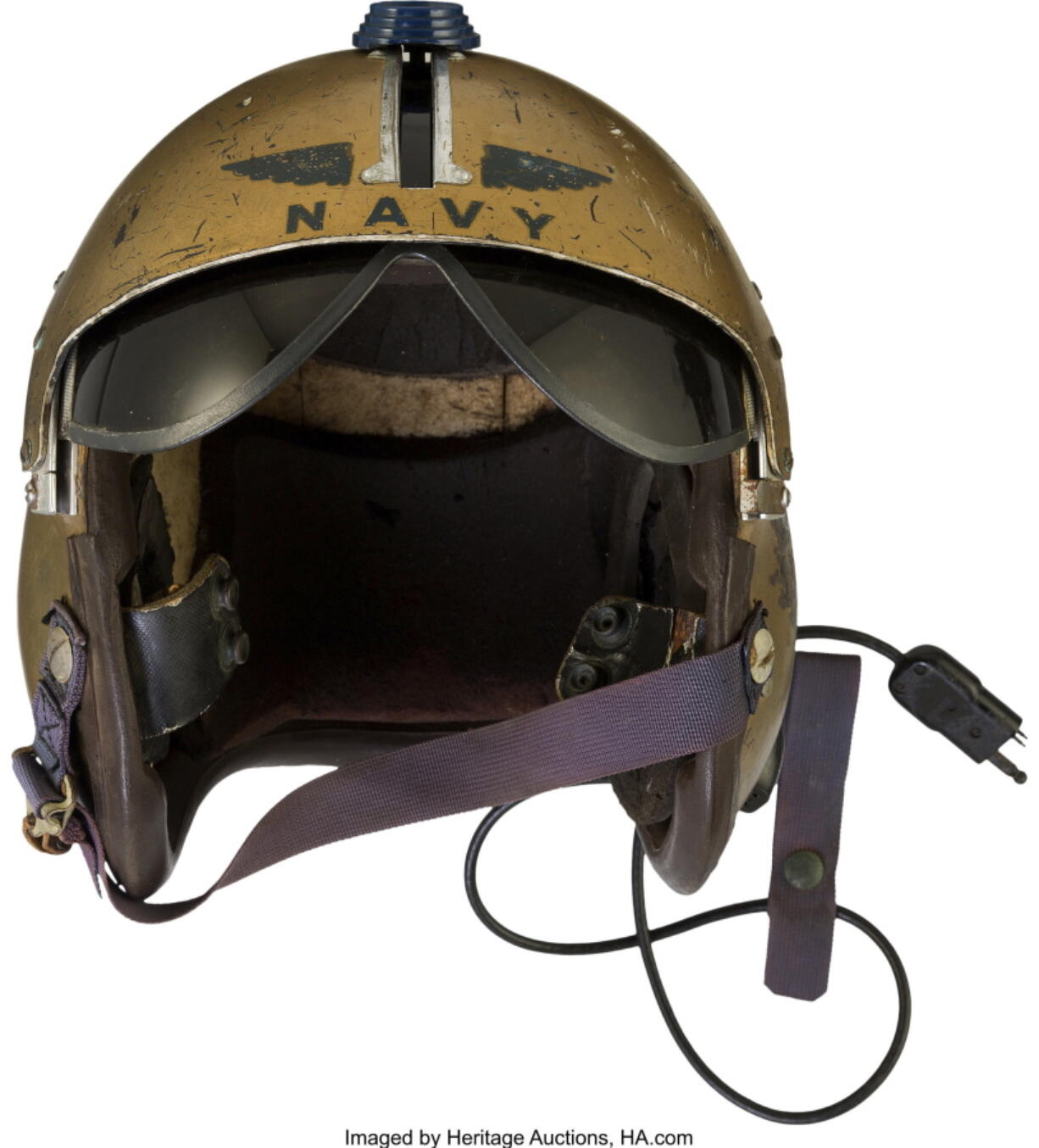 This undated photo provided by Heritage Auctions shows a helmet worn by John Glenn during the history-making flight, dubbed Project Bullet, in which the future astronaut set the transcontinental speed record in 1957. Artifacts owned by the late Neil Armstrong will be offered for sale by Dallas-based Heritage Auctions starting Thursday, Nov. 1, 2018, including pieces of a wing and propeller from the 1903 Wright Flyer the astronaut took with him to the moon in 1969.