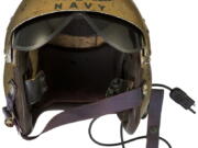 This undated photo provided by Heritage Auctions shows a helmet worn by John Glenn during the history-making flight, dubbed Project Bullet, in which the future astronaut set the transcontinental speed record in 1957. Artifacts owned by the late Neil Armstrong will be offered for sale by Dallas-based Heritage Auctions starting Thursday, Nov. 1, 2018, including pieces of a wing and propeller from the 1903 Wright Flyer the astronaut took with him to the moon in 1969.