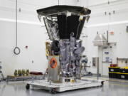 NASA’s Parker Solar Probe sits in a clean room at Astrotech Space Operations in Titusville, Fla., after the installation of its heat shield. Parker has made its first close approach to the sun, just 2 1/2 months after liftoff. The spacecraft flew within 15 million miles (24 million kilometers) of the sun’s surface Monday night, Nov. 5. Its speed topped 213,000 miles (342,000 kilometers) an hour relative to the sun, as it penetrated the outer solar atmosphere, or corona. No spacecraft has ever gotten so close to our star.