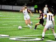 Prairie midfielder Maya Davis dribbles past a defender in the second half of a 3-1 loss to Holy Names in the 3A state semifinals at Puyallup's Sparks Stadium.