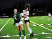 Camas sophomore defender Josephine Rein (right) fights for the ball with Skyline's Katelyn Reilly (left) in the Papermakers' 2-1 loss in the 4A state championship game at Sparks Stadium.