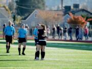 Prairie players embrace in the moments after the final whistle, marking the end of their season after a 3-0 loss at Sparks Stadium in Puyallup on Saturday, Nov. 17, 2018.