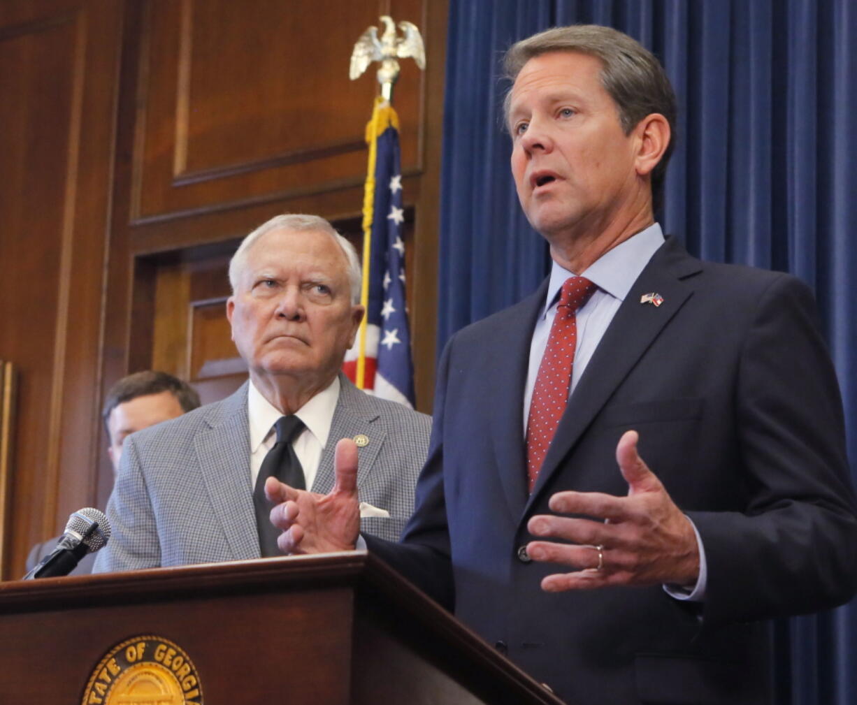 Republican Brian Kemp, right, speaks during a news conference as Georgia Gov. Nathan Deal listens in the Governor’s ceremonial office at the Capitol on Thursday, Nov. 8, 2018, in Atlanta, Ga. Kemp resigned Thursday as Georgia’s secretary of state, a day after his campaign said he’s captured enough votes to become governor despite his rival’s refusal to concede.