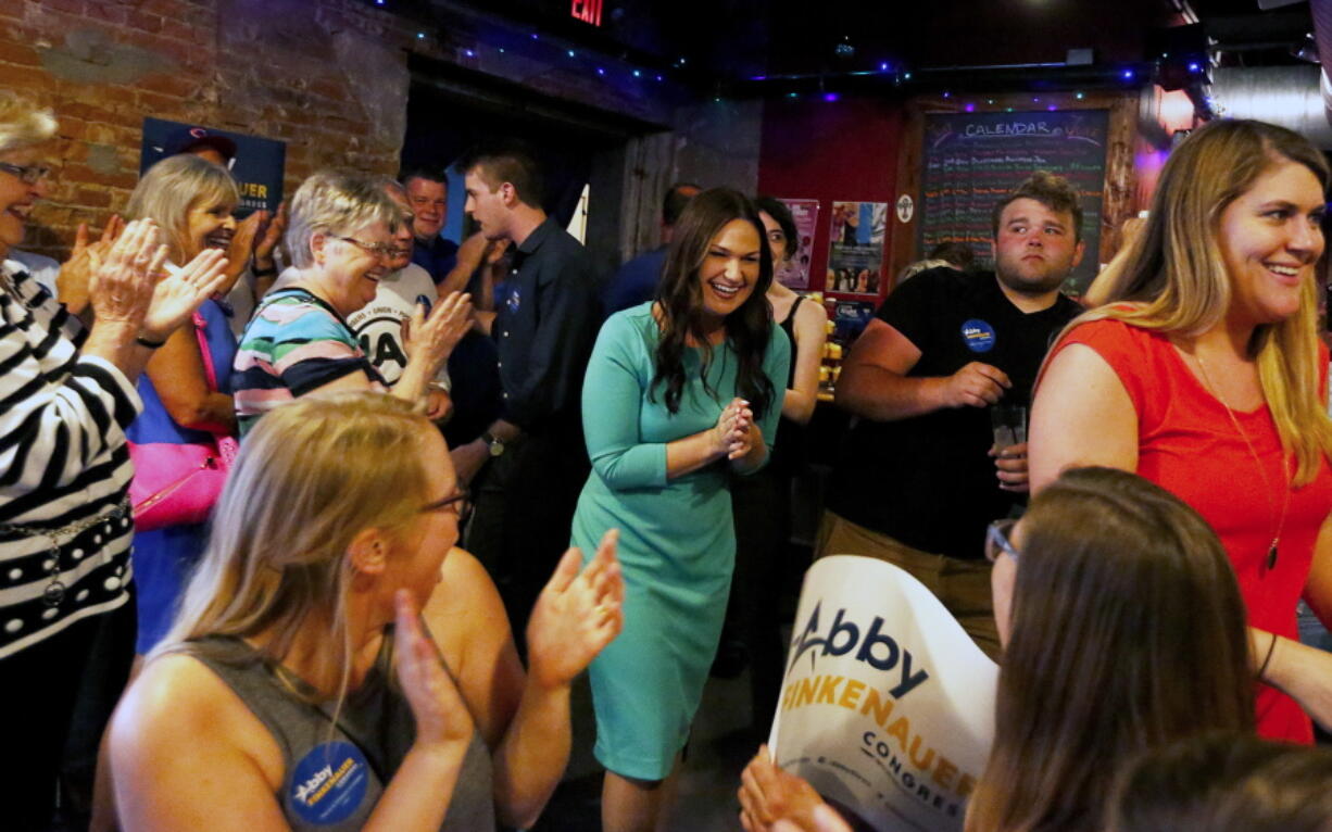 Iowa Rep. Abby Finkenauer walks into The Smokestack after winning the Democratic primary in Dubuque, Iowa. An often-overlooked battle is under way across rural and working-class America where President Donald Trump’s coalition of blue-collar voters offers Democrats an alternate route to the House majority. Finkenauer reflected on her blue-collar roots at a rally this week alongside the Democratic Party’s strongest liaison to working-class voters, former Vice President Joe Biden. “He shares the belief that every kid who grows up in a working-class family like mine has a right to a bright future,” Finkenauer said as she introduced Biden.