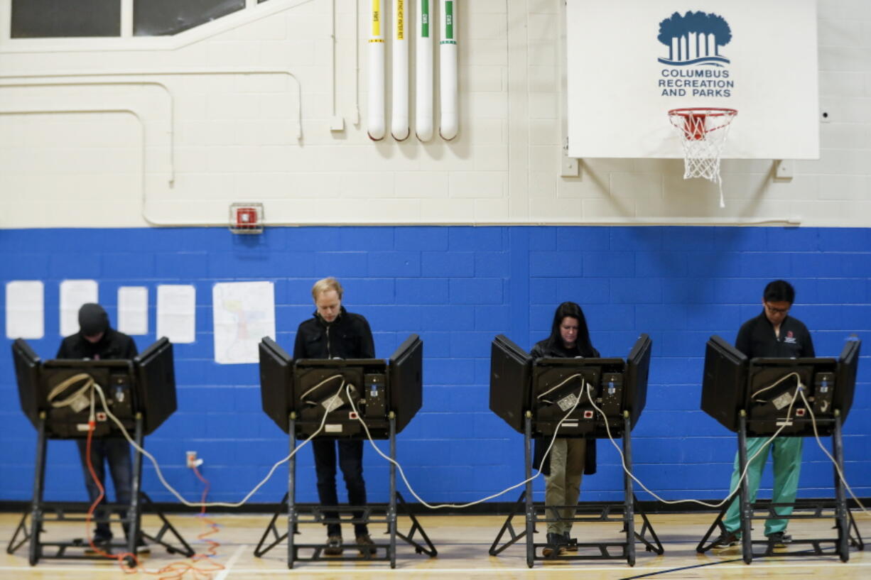 Voters cast their ballots at the Tuttle Park Recreation Center polling location, Tuesday, Nov. 6, 2018, in Columbus, Ohio. Across the country, voters headed to the polls Tuesday in one of the most high-profile midterm elections in years.