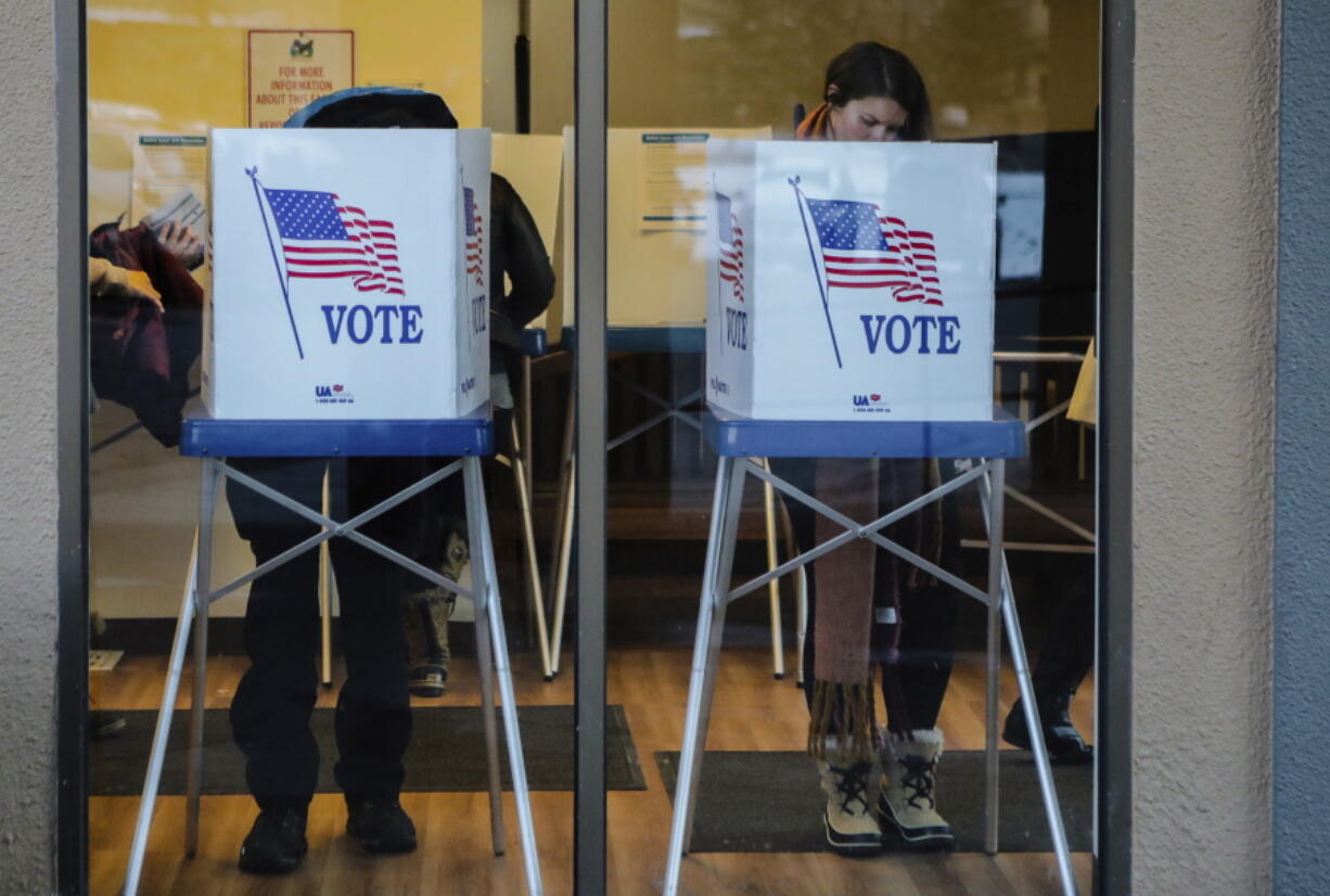 People vote during the midterms Tuesday, Nov. 6, 2018, in Avon, Colo.