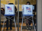 People vote during the midterms Tuesday, Nov. 6, 2018, in Avon, Colo.