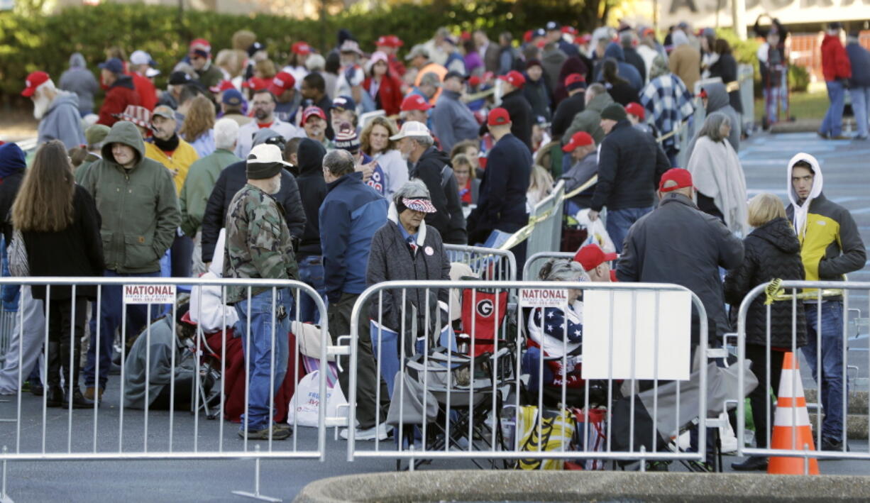 People wait in line outside McKenzie Arena in the early morning for a 7 p.m. rally by President Donald Trump Sunday, Nov. 4, 2018, in Chattanooga, Tenn.