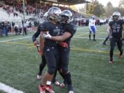 Union players Isaiah Jones, left, and Joseph Siofele  celebrate a touchdown against Bothell in the 4A state football quarterfinals.