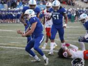 Mountain View running back Jack Mertens celebrates a touchdown against Rainier Beach in the 3A football quarterfinals.