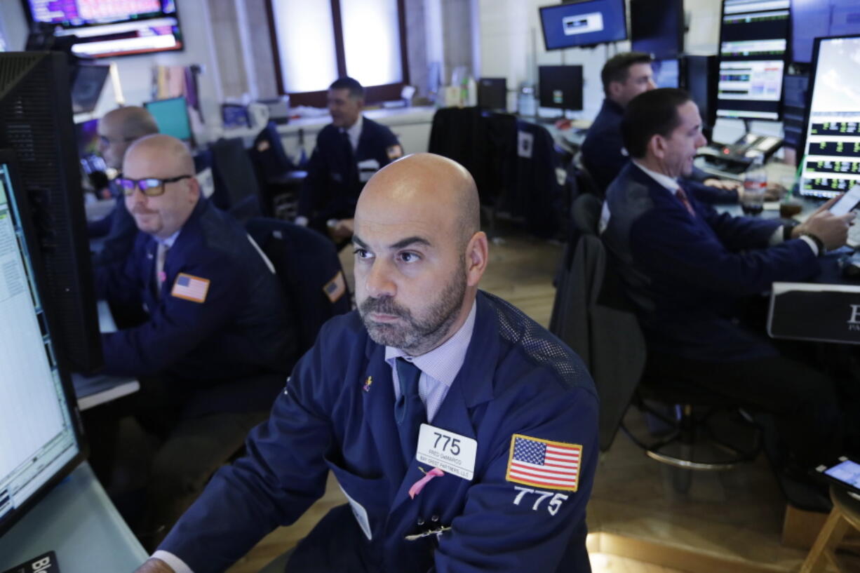 Trader Fred DeMarco follows stock activity, Monday, Nov. 19, 2018, at the New York Stock Exchange. Big technology and internet companies came under heavy selling pressure again on Monday, leading to broad losses across the stock market. The Dow Jones Industrial Average briefly fell 500 points.