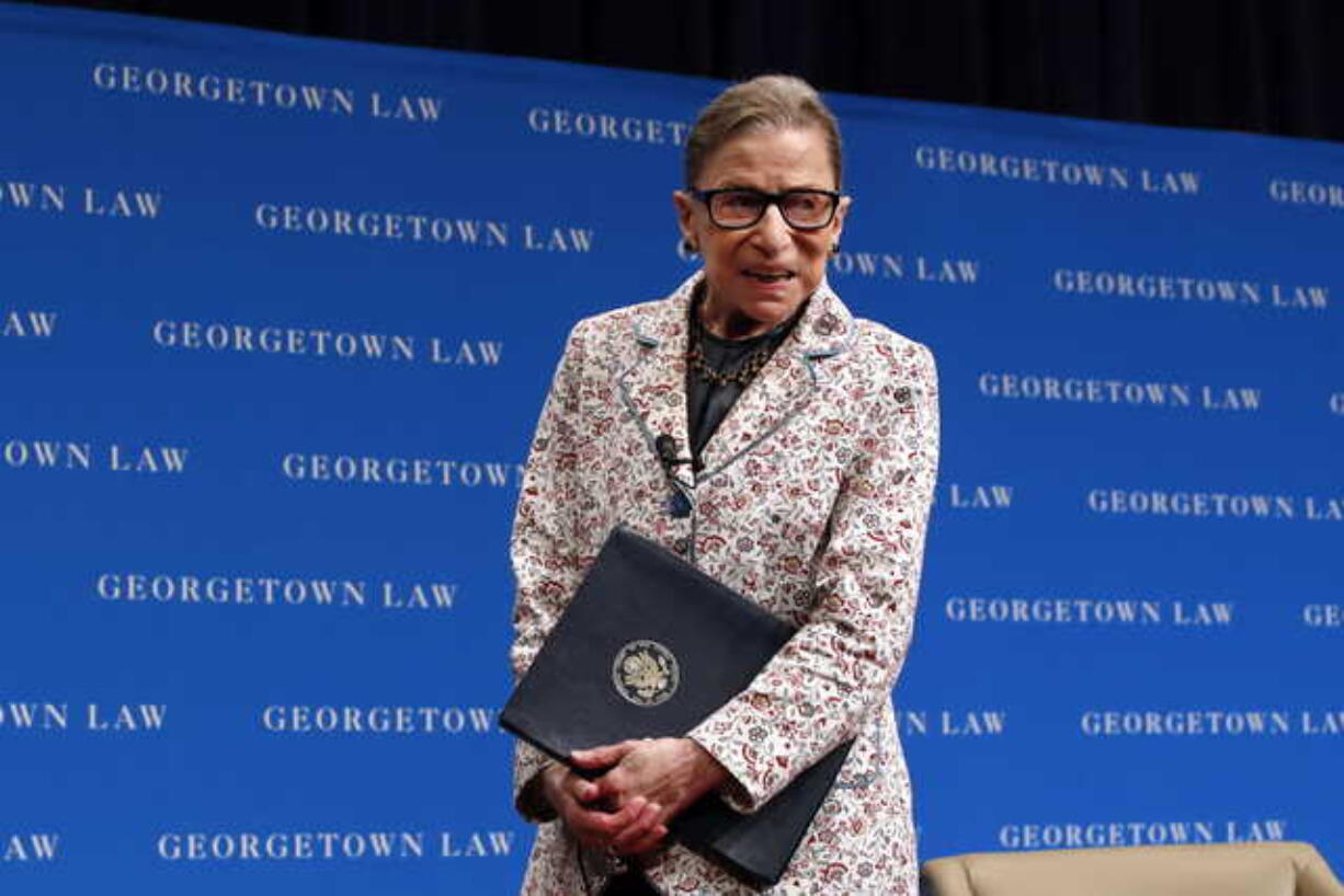 In this Sept. 26, 2018, file photo, Supreme Court Justice Ruth Bader Ginsburg leaves the stage after speaking to first-year students at Georgetown Law in Washington.