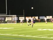 Columbia River's Julia Skimas blasts a free kick during the first half of Wednesday's Class 2A first-round girls soccer game against Olympic.