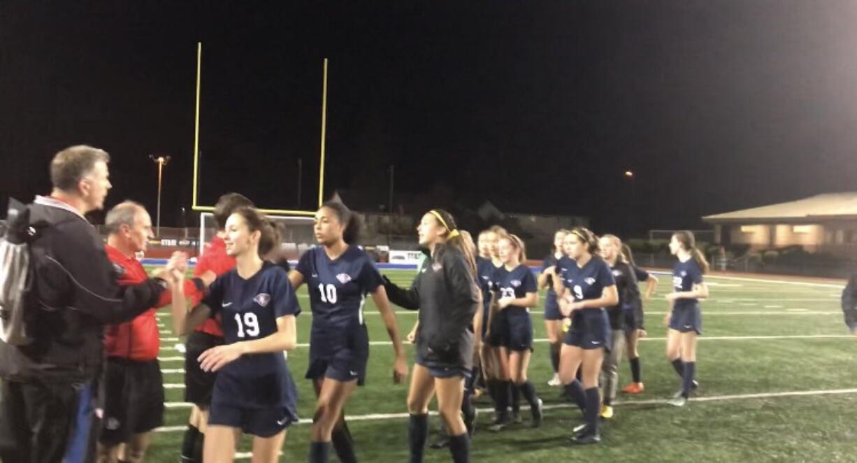 King's Way's Kate Roseburrough leads the celebration line thanking the officials after a 2-1 (4-3 PKs) victory Friday over Klahowya at Shoreline Stadium.