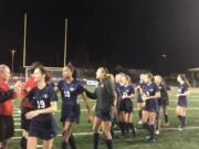 King's Way's Kate Roseburrough leads the celebration line thanking the officials after a 2-1 (4-3 PKs) victory Friday over Klahowya at Shoreline Stadium.