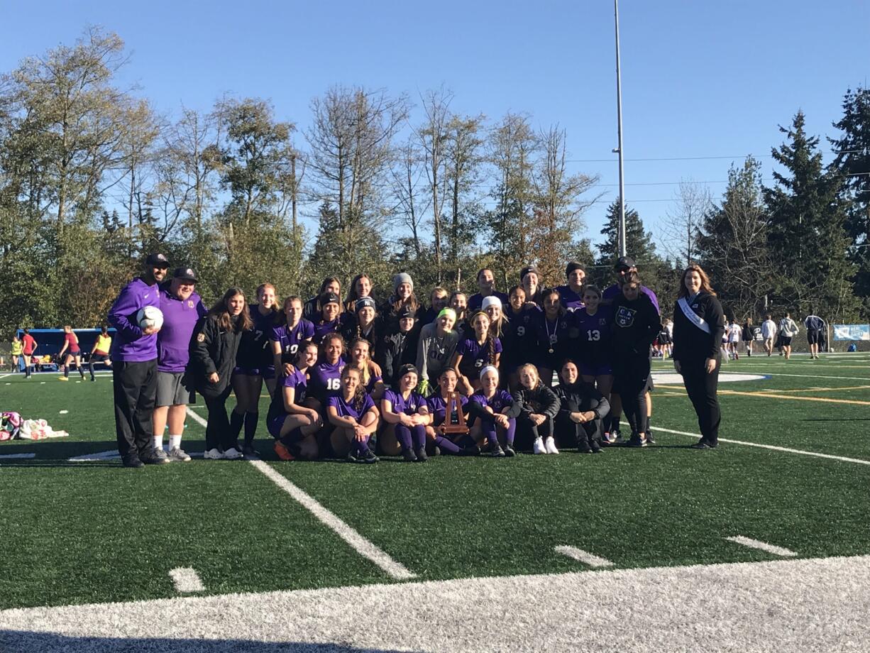 Columbia River players pose with the third-place trophy after Saturday's 1-0 win over Burlington-Edison.