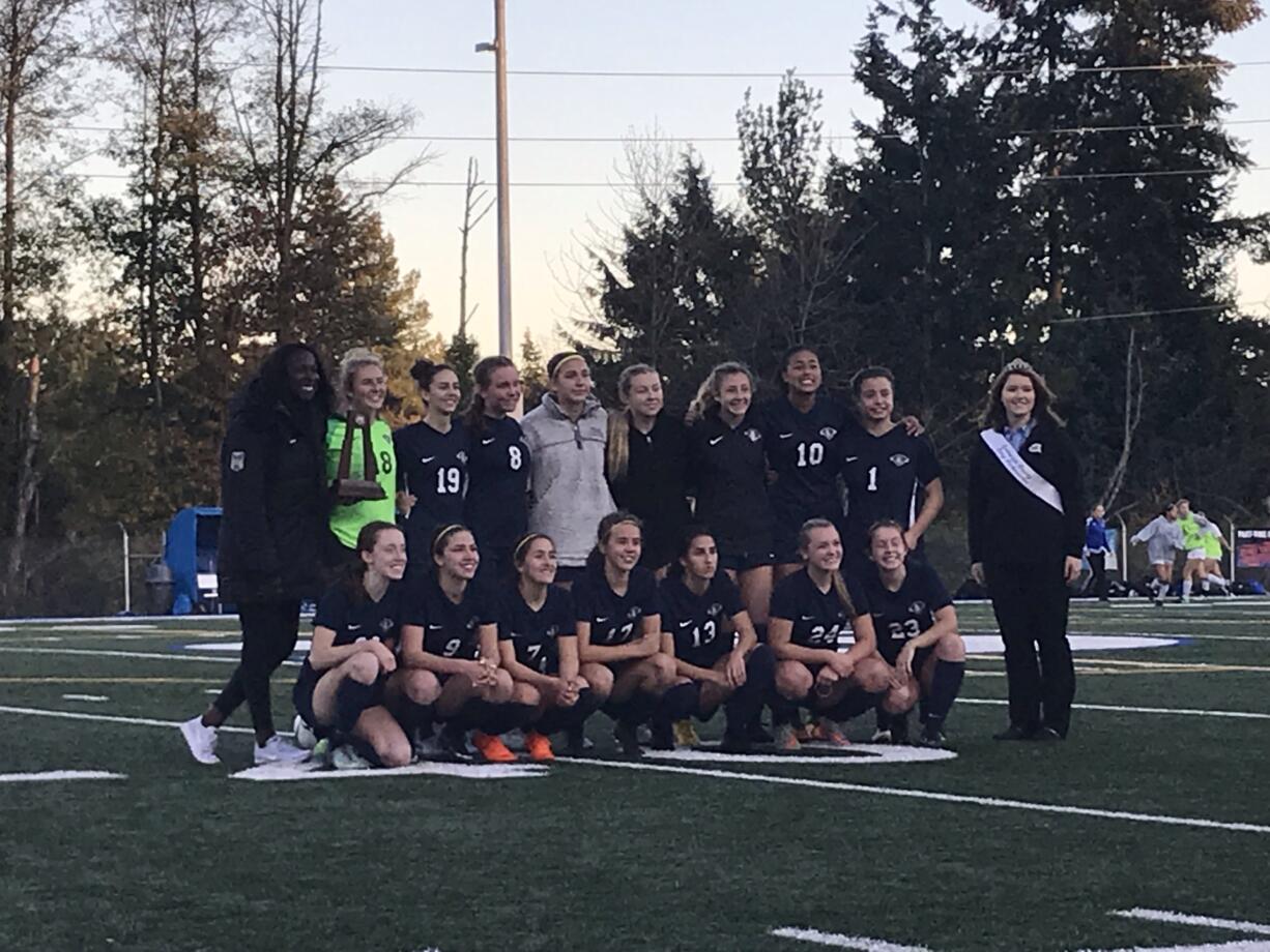 King's Way Christian poses with the second-place trophy after Saturday's 2-1 (2-1 PKs) loss to La Salle in the 1A state title game. The trophy is the first in program history for the Knights.