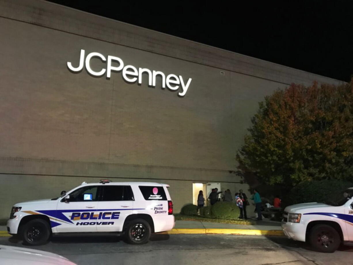 In this Thursday, Nov. 22, 2018 photo, police respond to a fight inside the Riverchase Galleria mall after gunfire erupted Thanksgiving night in Hoover, Ala. Police shot and killed a man who had brandished a weapon, authorities said Friday. Several other people were injured, including a 12-year-old girl.