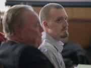 Todd Marjama, right, who is accused of killing his wife, listens to opening statements at the Clark County Courthouse on Tuesday morning. His attorney argued the fatal shooting was an accident.