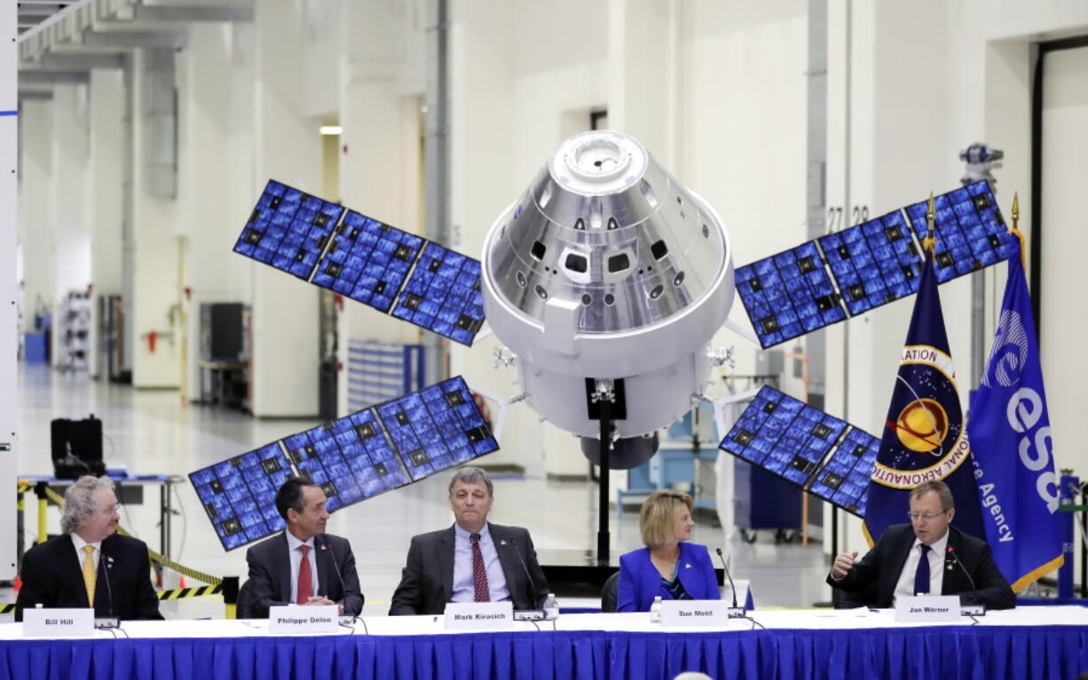 European Space Agency director general Jan Worner, far right, answers questions Friday during a panel discussion with U.S. and European leaders. From left are, Bill Hill of NASA, Philippe Berthe of the ESA, Mark Kirasich of NASA and Sue Motil, Orion European Service Module integration manager. Behind them is a model of the Orion capsule and the service module.