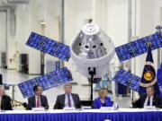 European Space Agency director general Jan Worner, far right, answers questions Friday during a panel discussion with U.S. and European leaders. From left are, Bill Hill of NASA, Philippe Berthe of the ESA, Mark Kirasich of NASA and Sue Motil, Orion European Service Module integration manager. Behind them is a model of the Orion capsule and the service module.