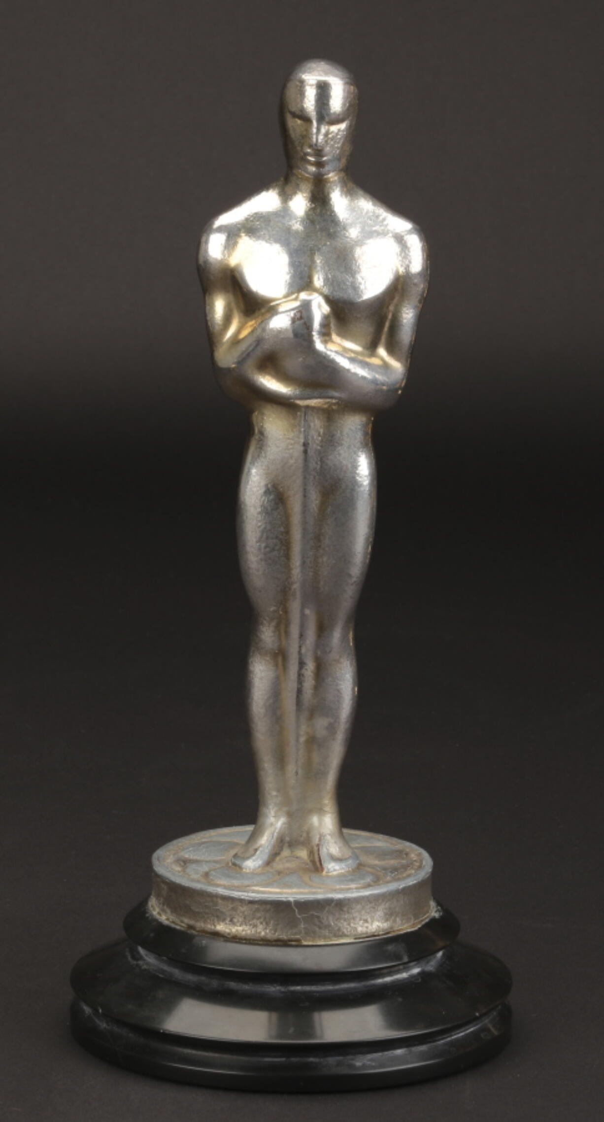 This undated image provided by Profiles in History shows Irving Thalberg’s Academy Award for best picture in “Mutiny on the Bounty.” The award is expected to go for between $200,000 and $300,000 at auction.