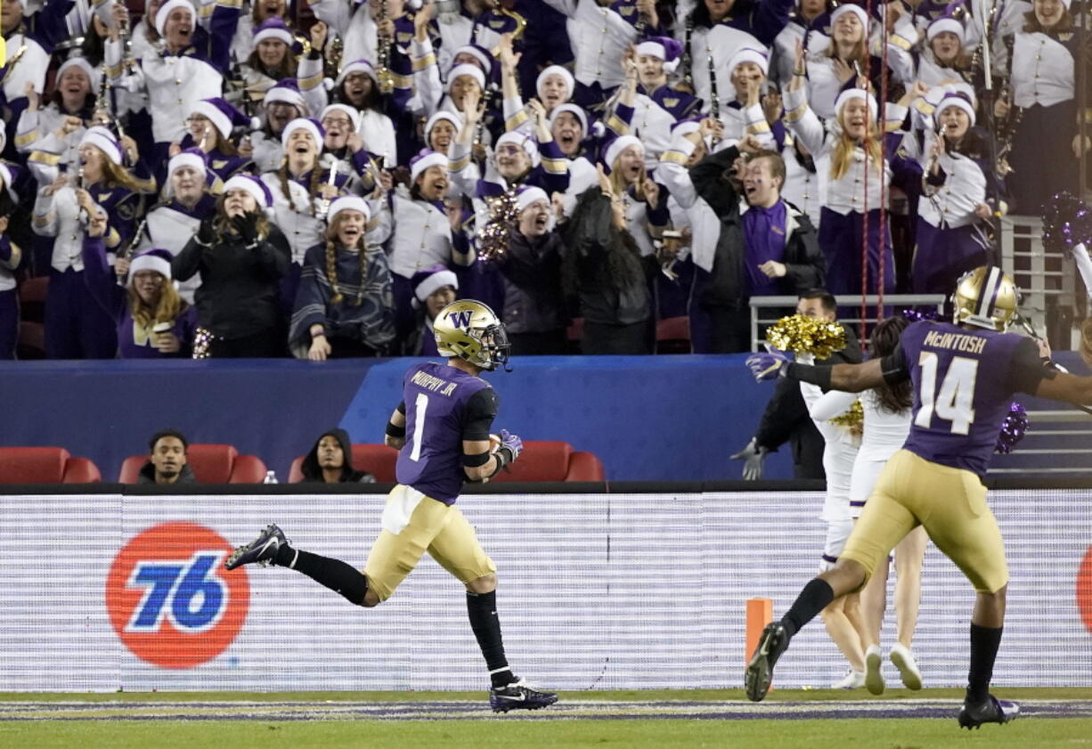 Washington defensive back Byron Murphy (1) returns an interception for a touchdown against Utah during the second half of the Pac-12 Conference championship NCAA college football game in Santa Clara, Calif., Friday, Nov. 30, 2018.