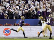 Washington defensive back Byron Murphy (1) returns an interception for a touchdown against Utah during the second half of the Pac-12 Conference championship NCAA college football game in Santa Clara, Calif., Friday, Nov. 30, 2018.